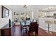 Dining room and partial kitchen view with hardwood floors and plenty of windows and natural light at 4342 Richmond Nw Pl, Acworth, GA 30101