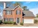 Charming two-story brick home with black shutters, a two-car garage and a manicured front yard at 4342 Richmond Nw Pl, Acworth, GA 30101