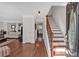 Inviting entryway features hardwood floors, staircase, and view into the living room at 4342 Richmond Nw Pl, Acworth, GA 30101