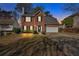 Charming two-story brick home with well-kept lawn and driveway, attached two-car garage at 4342 Richmond Nw Pl, Acworth, GA 30101