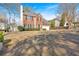 Two-story home with well-manicured lawn, attached garage, and classic brick facade at 4342 Richmond Nw Pl, Acworth, GA 30101