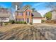 Well-maintained two-story brick home with an attached two-car garage and a long driveway at 4342 Richmond Nw Pl, Acworth, GA 30101