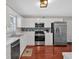 Modern kitchen with stainless steel appliances, white cabinets, and sleek countertops at 4342 Richmond Nw Pl, Acworth, GA 30101