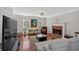 Bright living room features hardwood floors, fireplace and modern furniture at 4342 Richmond Nw Pl, Acworth, GA 30101
