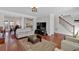 Spacious living room featuring hardwood floors and views to the dining area and staircase at 4342 Richmond Nw Pl, Acworth, GA 30101