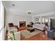 Well-lit living room with fireplace, hardwood floors, rug and views to the dining room at 4342 Richmond Nw Pl, Acworth, GA 30101