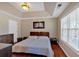 Comfortable main bedroom featuring trey ceilings, a large window and hardwood flooring at 4342 Richmond Nw Pl, Acworth, GA 30101
