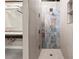 Shower room with modern tile, fixtures and marble wall accents at 490 Marietta Nw St # 105, Atlanta, GA 30313