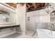 Elegant bathroom featuring a walk-in shower, soaking tub, and dual sinks at 490 Marietta Nw St # 105, Atlanta, GA 30313
