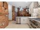 Modern kitchen featuring stainless steel dishwasher, gas range, faucet, and custom cabinets at 490 Marietta Nw St # 105, Atlanta, GA 30313