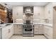 Modern kitchen featuring stainless steel gas range, faucet, and custom cabinets at 490 Marietta Nw St # 105, Atlanta, GA 30313