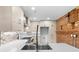 Modern kitchen featuring stainless steel faucet, custom cabinets, mosaic backsplash and gas range at 490 Marietta Nw St # 105, Atlanta, GA 30313