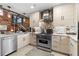 Modern kitchen featuring stainless steel dishwasher, gas range, faucet, and custom cabinets at 490 Marietta Nw St # 105, Atlanta, GA 30313