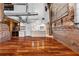 Open-concept living space with exposed brick walls and modern kitchen area at 490 Marietta Nw St # 105, Atlanta, GA 30313