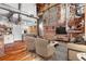 Modern living room with exposed brick, hardwood floors, and open-concept design at 490 Marietta Nw St # 105, Atlanta, GA 30313