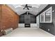 Bright living room with skylights, exposed brick wall, fireplace and modern accents at 490 Marietta Nw St # 105, Atlanta, GA 30313