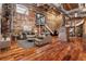 Spacious industrial-style living room with exposed brick, ductwork, and an open floor plan at 490 Marietta Nw St # 105, Atlanta, GA 30313