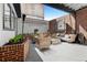 Outdoor patio with modern seating and exposed brick accents at 490 Marietta Nw St # 105, Atlanta, GA 30313