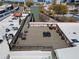 Aerial view of a rooftop deck with various seating and entertainment areas at 490 Marietta Nw St # 105, Atlanta, GA 30313