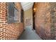 Exterior brick walkway featuring a gated entrance, providing secured access and an architectural feature at 490 Marietta Nw St # 105, Atlanta, GA 30313