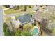 Aerial view of the property with a kidney-shaped pool and manicured landscaping, nestled in a friendly neighborhood at 500 Poplar Creek Xing, Canton, GA 30114