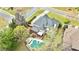 An aerial perspective highlights a pool, deck, and gazebo surrounded by lush greenery, offering a private oasis at 500 Poplar Creek Xing, Canton, GA 30114