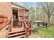 Stairs lead to a backyard featuring a pool and gazebo at 500 Poplar Creek Xing, Canton, GA 30114
