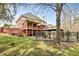 Spacious backyard featuring a large deck, gazebo, and a well-maintained lawn area perfect for outdoor activities at 500 Poplar Creek Xing, Canton, GA 30114