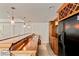 Beautiful basement bar featuring a wooden countertop, ample storage, and a black refrigerator at 500 Poplar Creek Xing, Canton, GA 30114