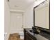 Bathroom featuring dark vanity with a black granite countertop and a tub shower at 500 Poplar Creek Xing, Canton, GA 30114