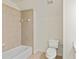Tiled bathroom featuring a shower-tub and a standard toilet and vanity with ample space at 500 Poplar Creek Xing, Canton, GA 30114