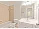 Full bathroom with tile, a bathtub, toilet and sink with white vanity at 500 Poplar Creek Xing, Canton, GA 30114
