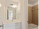 Bright bathroom with a white vanity, a large mirror, and a view into another room at 500 Poplar Creek Xing, Canton, GA 30114