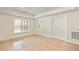 Bedroom featuring neutral walls, large windows offering natural light, and a private entry door to the outside at 500 Poplar Creek Xing, Canton, GA 30114