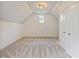 Spacious bedroom with soft carpet, a window, and access to a closet offering comfort at 500 Poplar Creek Xing, Canton, GA 30114
