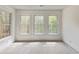 Bedroom with three windows offering excellent light with neutral carpeting and paint at 500 Poplar Creek Xing, Canton, GA 30114