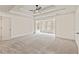 Very spacious bedroom features double doors, tray ceiling with ceiling fan, and many windows at 500 Poplar Creek Xing, Canton, GA 30114