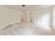 A very large bedroom features neutral carpeting and a closet, offering space and storage at 500 Poplar Creek Xing, Canton, GA 30114