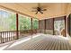 Enjoy outdoor living on this spacious deck with a ceiling fan and screened lattice for privacy at 500 Poplar Creek Xing, Canton, GA 30114