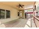 Large covered deck featuring a ceiling fan, views of the backyard, and additional seating areas at 500 Poplar Creek Xing, Canton, GA 30114