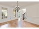 Welcoming entryway showcasing hardwood floors and a leaded glass door at 500 Poplar Creek Xing, Canton, GA 30114