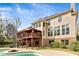 Beautiful home exterior showcasing a multi-level deck, walkout basement, and a kidney-shaped pool perfect for relaxation at 500 Poplar Creek Xing, Canton, GA 30114