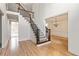 Inviting foyer with a staircase, hardwood floors, and chandelier in a light filled room at 500 Poplar Creek Xing, Canton, GA 30114