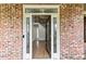 Elegant foyer with hardwood floors, glass sidelights, and a glimpse of the staircase, showcasing the home's interior at 500 Poplar Creek Xing, Canton, GA 30114