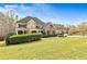 Charming two-story home with brick accents, a landscaped yard, and a covered front porch at 500 Poplar Creek Xing, Canton, GA 30114