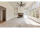 Bright and airy living area featuring a stone fireplace and large windows at 500 Poplar Creek Xing, Canton, GA 30114