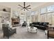 Staged living room boasting a stone fireplace, built-in shelves, and large windows at 500 Poplar Creek Xing, Canton, GA 30114