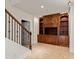 Inviting living room featuring built-in wooden shelving, cabinets and a staircase at 500 Poplar Creek Xing, Canton, GA 30114