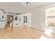 Spacious living room featuring hardwood floors with easy access to the kitchen at 500 Poplar Creek Xing, Canton, GA 30114