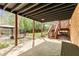 Large stone patio with view of the backyard and pool at 500 Poplar Creek Xing, Canton, GA 30114